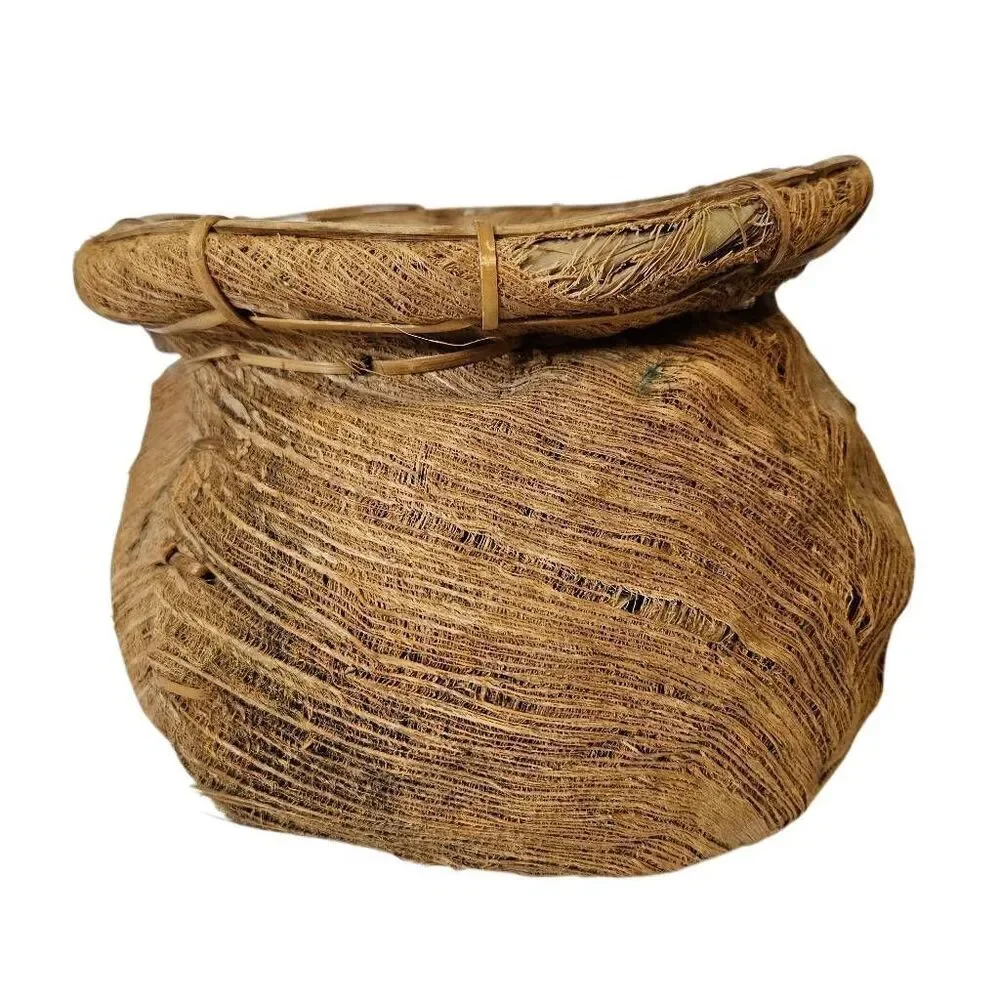 Primitive handmade basket, dried palm leaf woven.